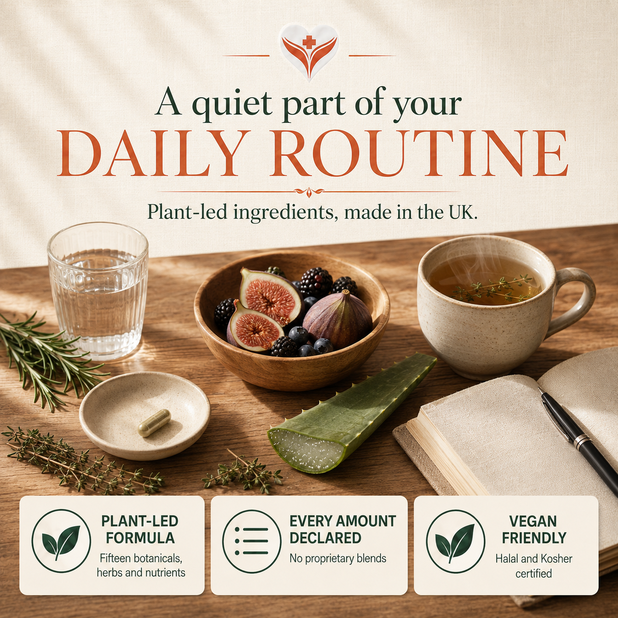 A Restore Balance Complex capsule in a ceramic dish beside a glass of water, herbal tea, a bowl of figs and berries, fresh rosemary and aloe vera on a wooden table